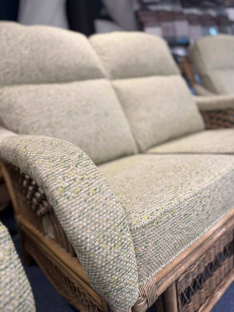 Reupholstered furniture with green textured fabric